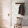 Taupe geometric wallpaper with minimalist Art Deco styling and repeating botanical fan motifs.