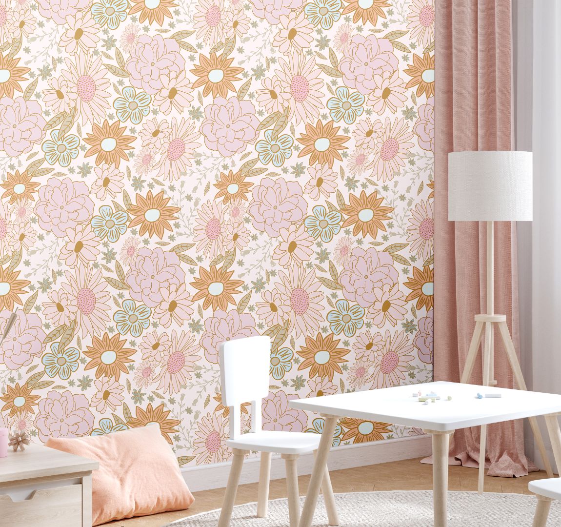  Peach Petal Field Wallpaper behind a playroom table setup, displaying its large-scale floral pattern in peach, tan, and blush hues.