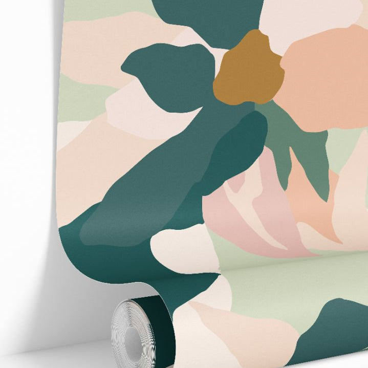 Petal Mirage Wallpaper roll featuring soft painterly petals in blush, green, and golden tones on a neutral background.