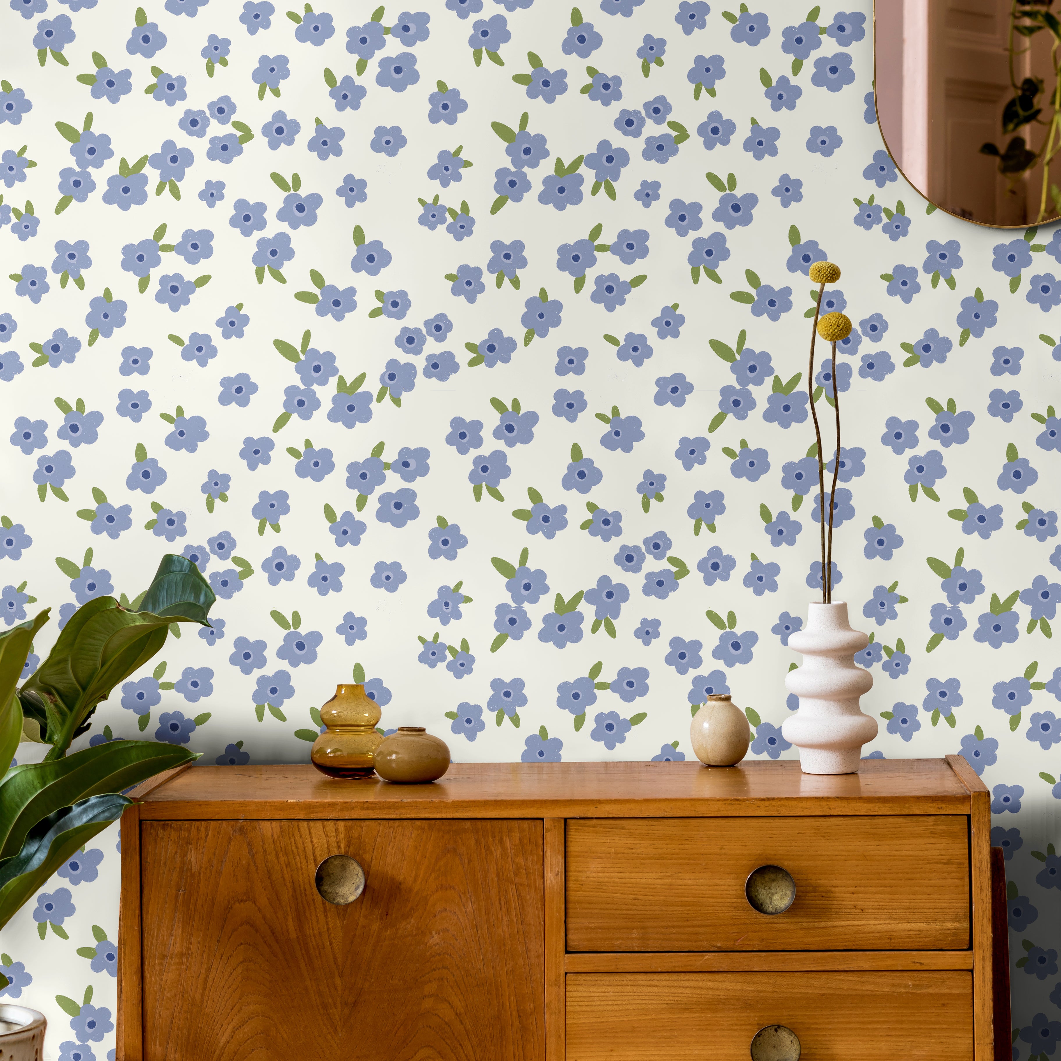Light Blue floral wallpaper with scattered white and soft blue flowers on a light background in a cozy bedroom setting