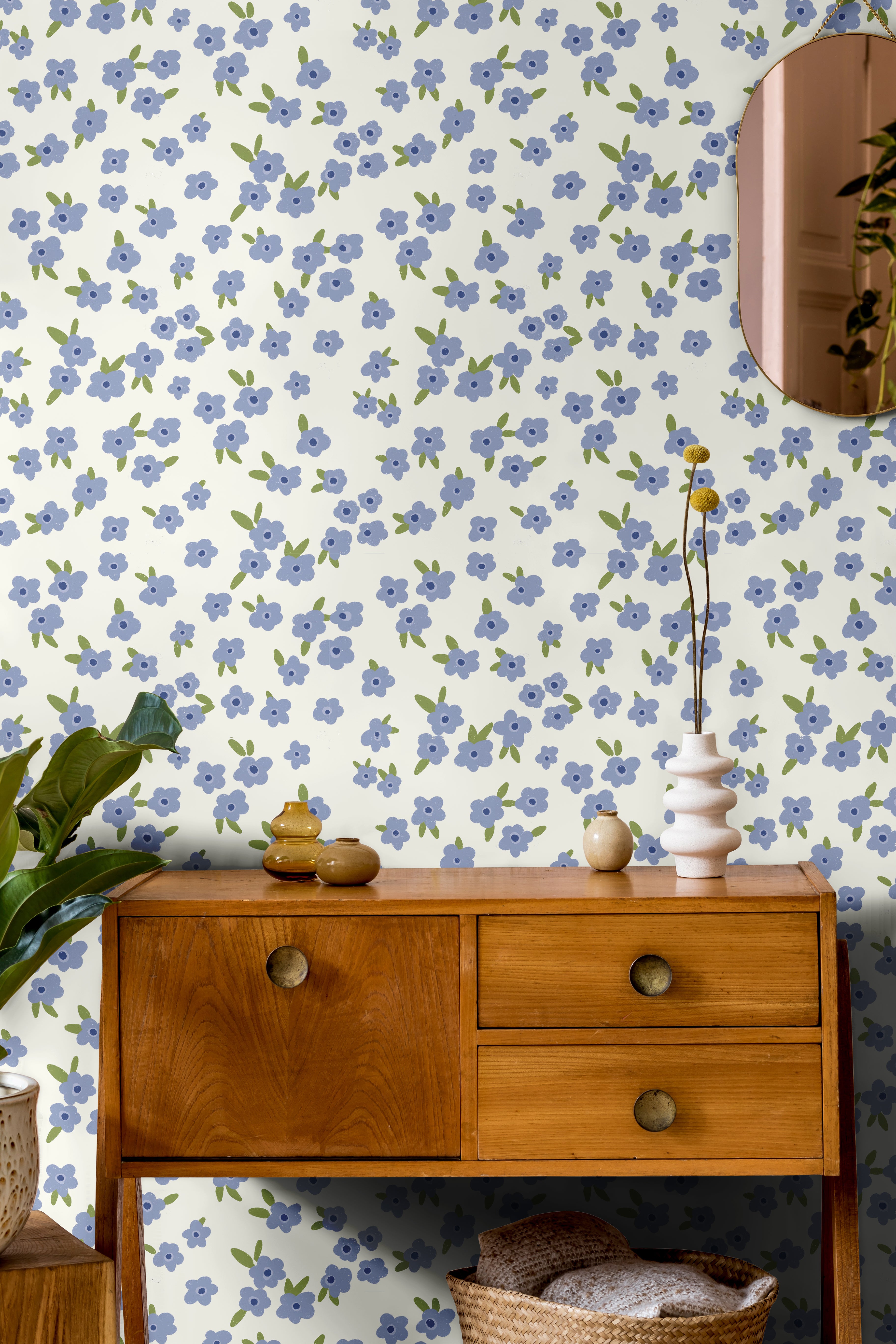 Light Blue floral wallpaper with scattered white and soft blue flowers on a light background in a cozy bedroom setting