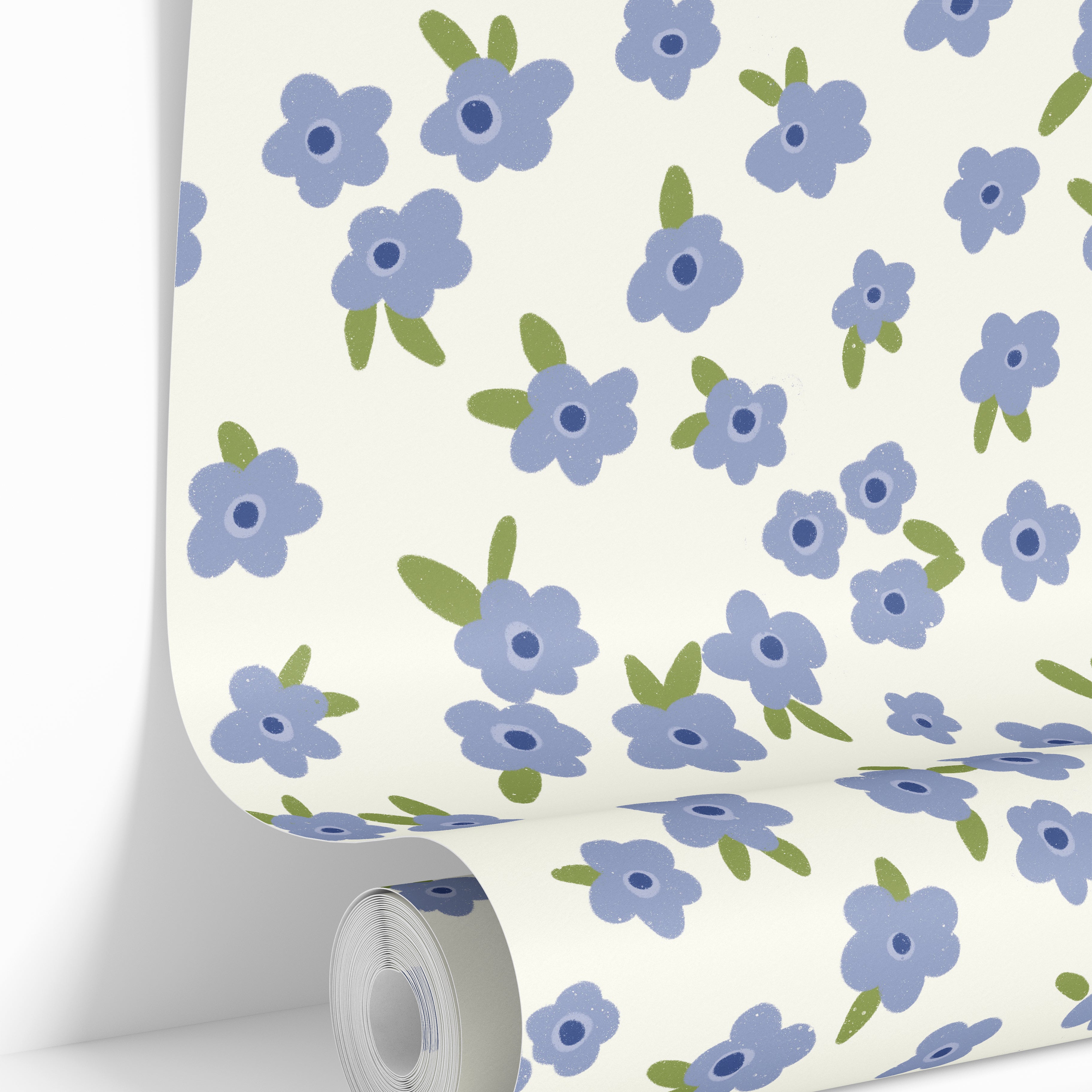 Wallpaper roll featuring the Petal Theory vintage floral wallpaper pattern with soft scattered blue blooms.