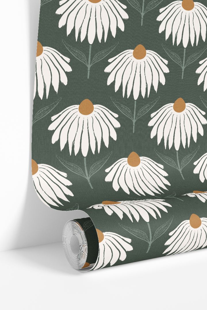 Wallpaper roll showing large white daisy blooms on a deep green background
