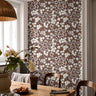 Room image: earthy mauve floral wallpaper with muted botanical calico pattern in a styled interior