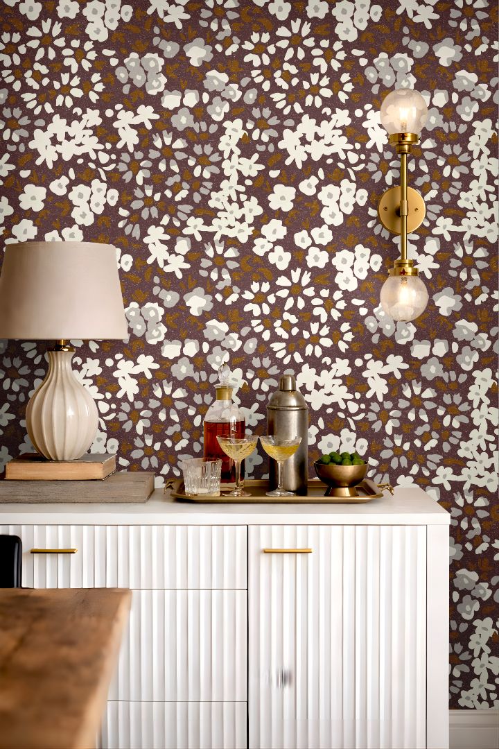 Detail image: close up of earthy mauve floral wallpaper with calico inspired botanical pattern