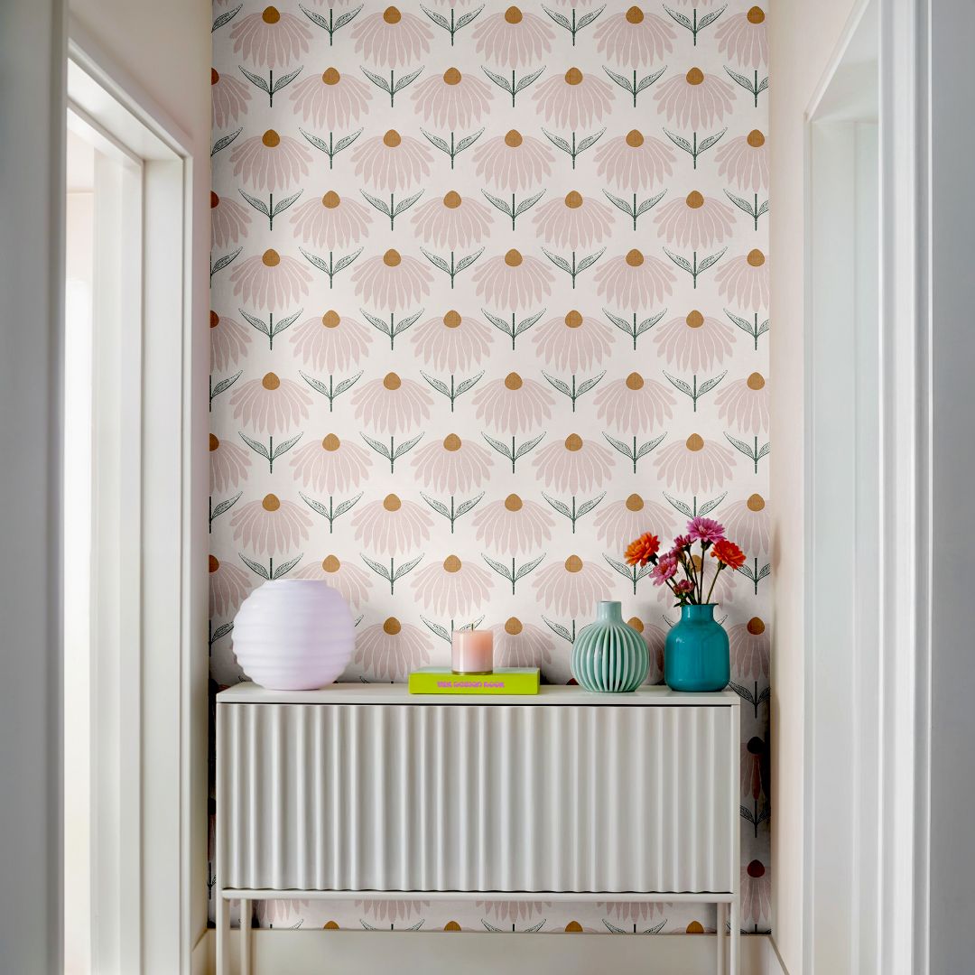 Petalline Blush Wallpaper – 2241 with blush coneflower-style florals, warm golden centers, and muted green stems on a linen-textured background