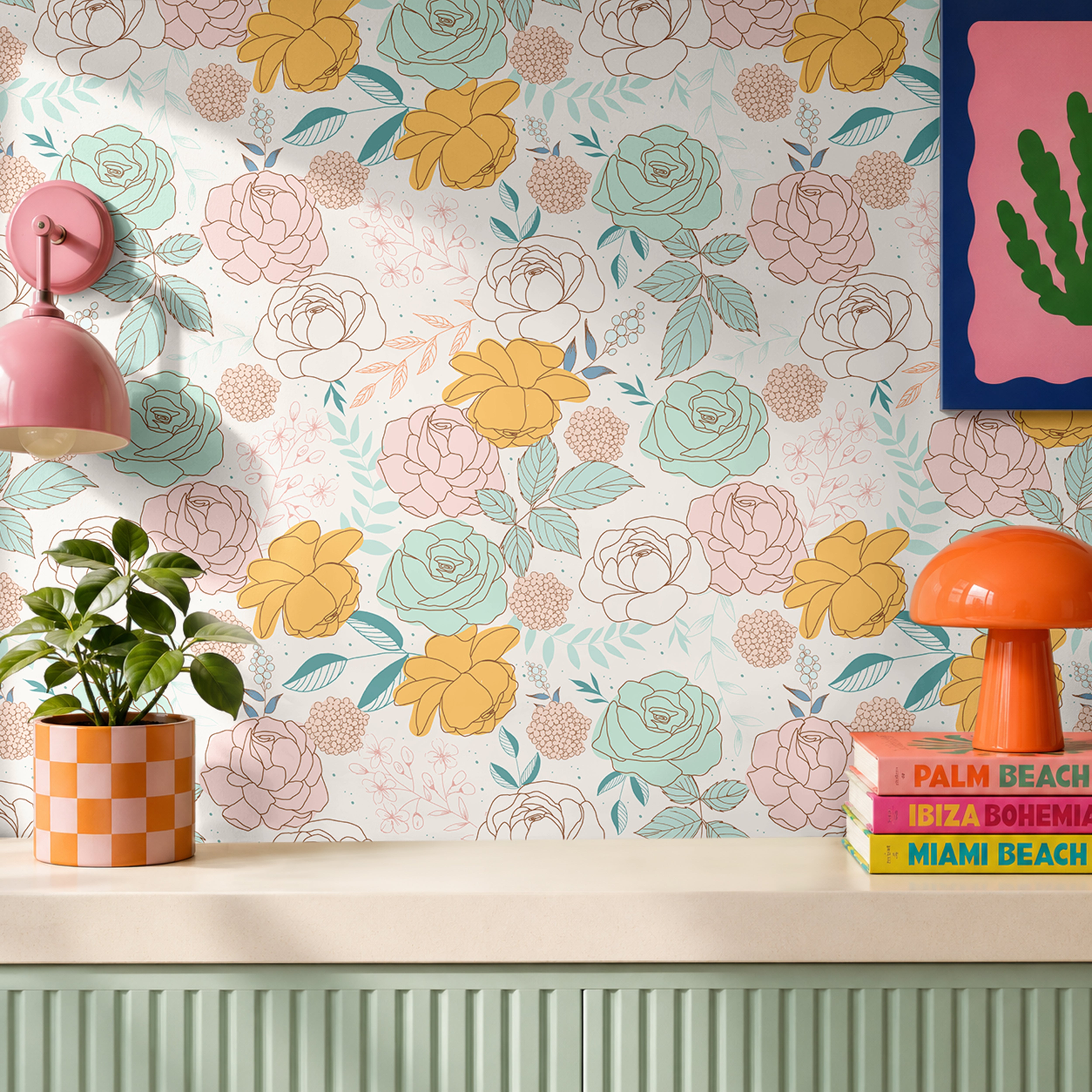 Pink, yellow and mint blooming roses on  white background with multi-colored leaves in a colorful living space