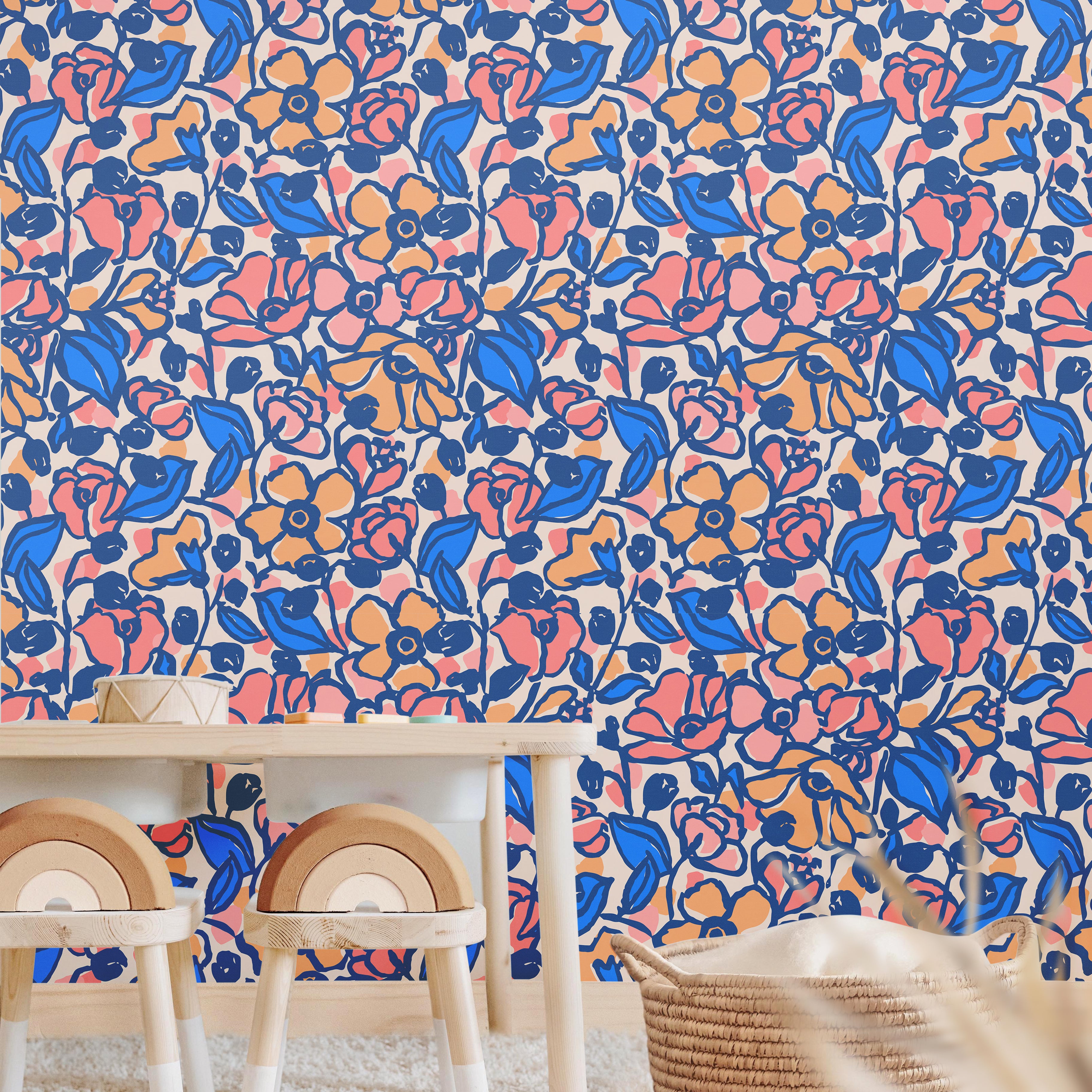 Bold retro-inspired floral wallpaper with blue and peach botanical pattern in a bright modern playroom.