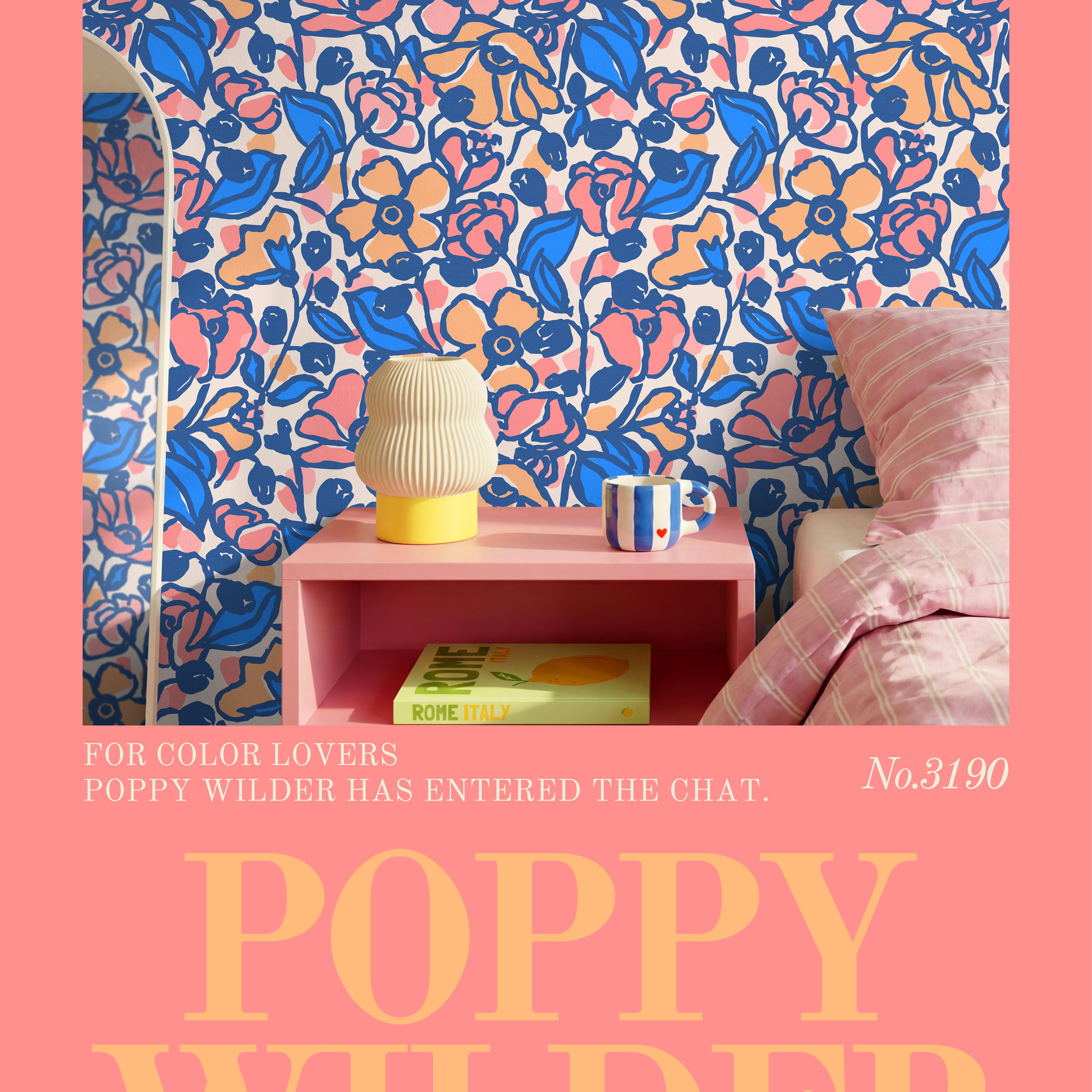 Featuring cobalt blue, blush peach, and pink floral wallpaper with playful retro-inspired botanical styling