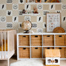 kids checker wallpaper with icons in tan and black modern bedroom setting