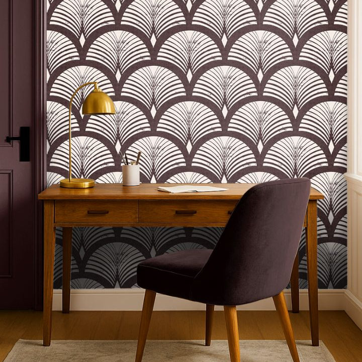 reservecroft burgundy fan wallpaper behind wood desk with brass lamp and plum chair