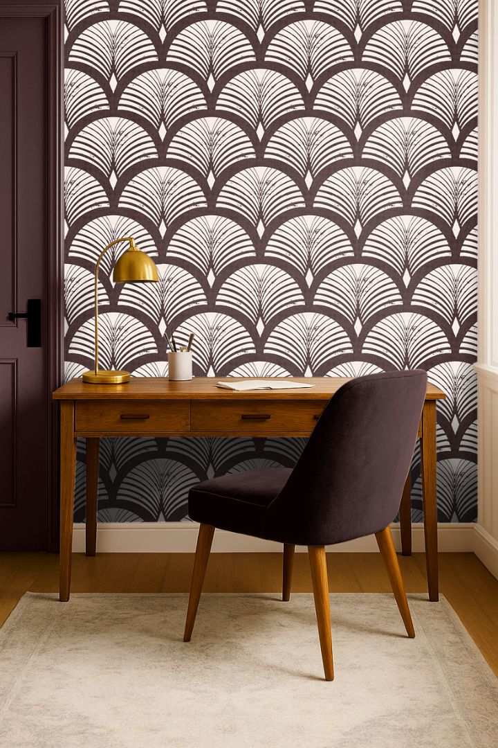 reservecroft burgundy fan wallpaper behind wood desk with brass lamp and plum chair