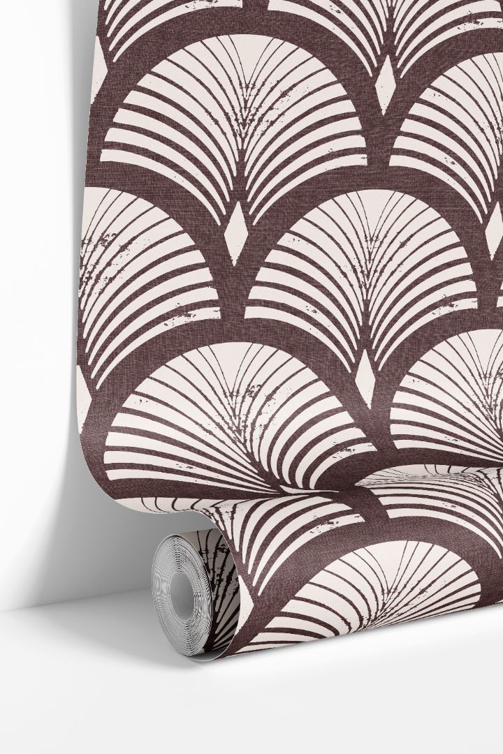roll of reservecroft burgundy wallpaper with warm ivory fan arches and woven look texture