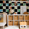 bold dinosaur wallpaper for kids bedroom with black checker background
