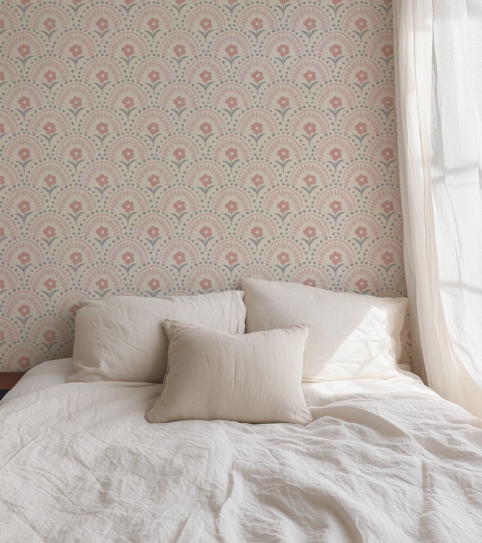 Rosette Arch Wallpaper with blush floral pattern styled in cozy bedroom with beige linens