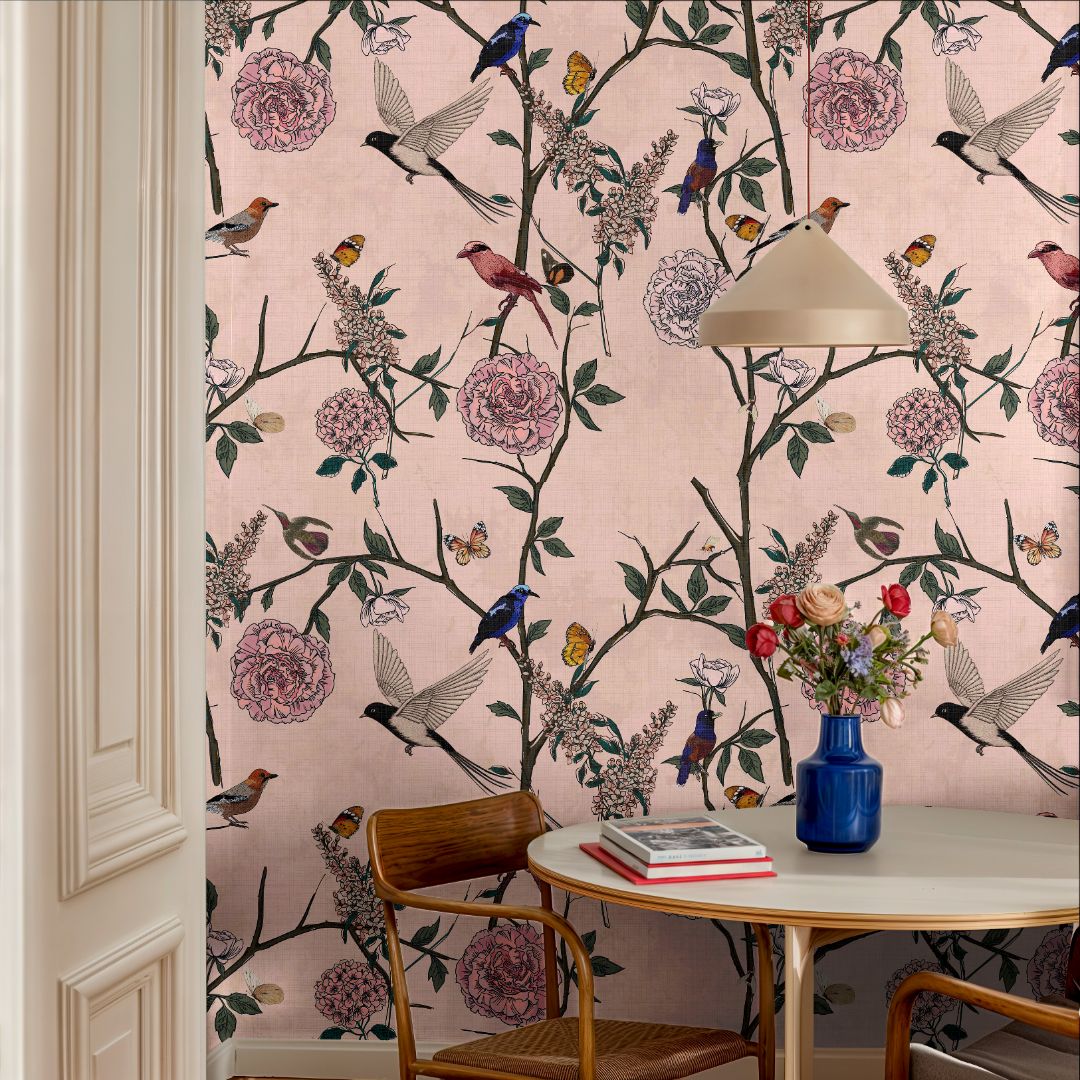 Rosy Aviary wallpaper with soft pink background, birds and flowers in a bright dining space