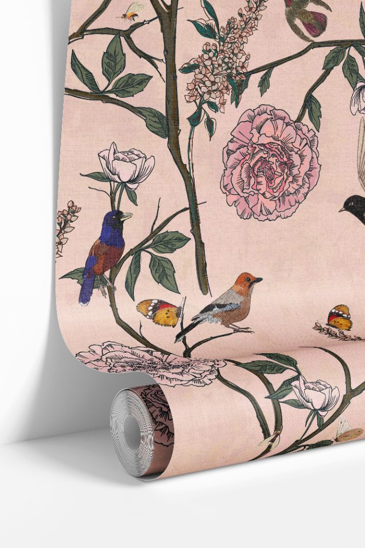 Rosy Aviary wallpaper roll showing blush background with birds, butterflies, and florals by James & Colors
