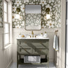 Sage Haven Neutral Floral Wallpaper – soft botanical pattern with sage green leaves and cream florals on a neutral background, styled in a serene bedroom interior.