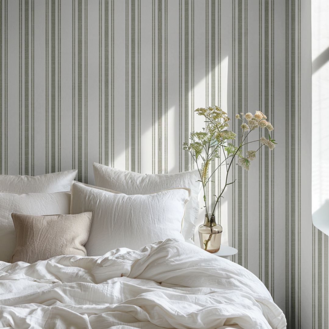 Sage Lineage wallpaper with soft green vertical stripes creating calm, airy bedroom atmosphere