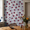 sapphire blue floral wallpaper with scattered jewel toned blossoms in artistic botanical pattern
