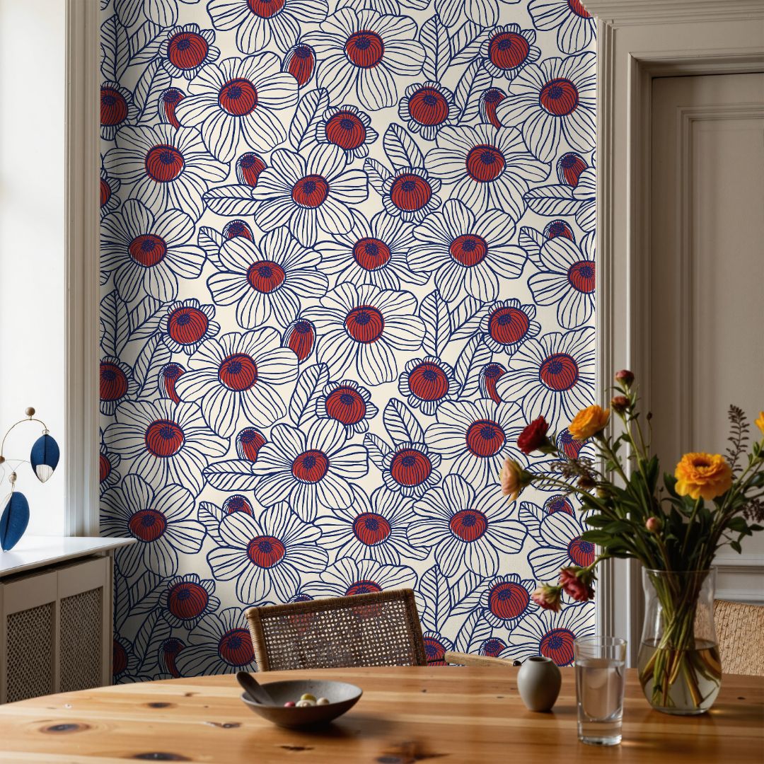 sapphire blue floral wallpaper with scattered jewel toned blossoms in artistic botanical pattern