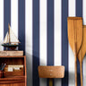 classic navy pinstripe wallpaper with red detail in office setting