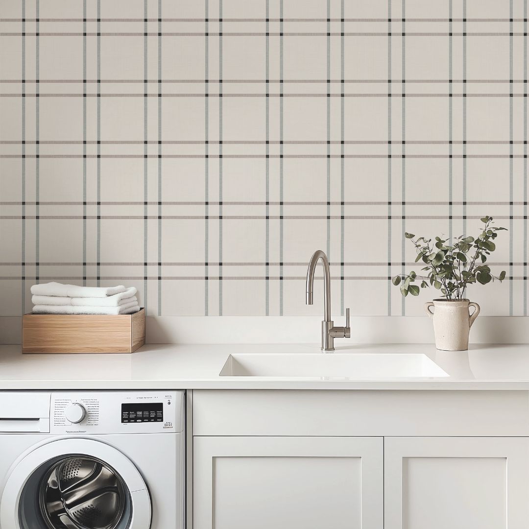 laundry room with serene grid neutral plaid wallpaper in taupe and gray, featuring washer and dryer with clean minimal decor