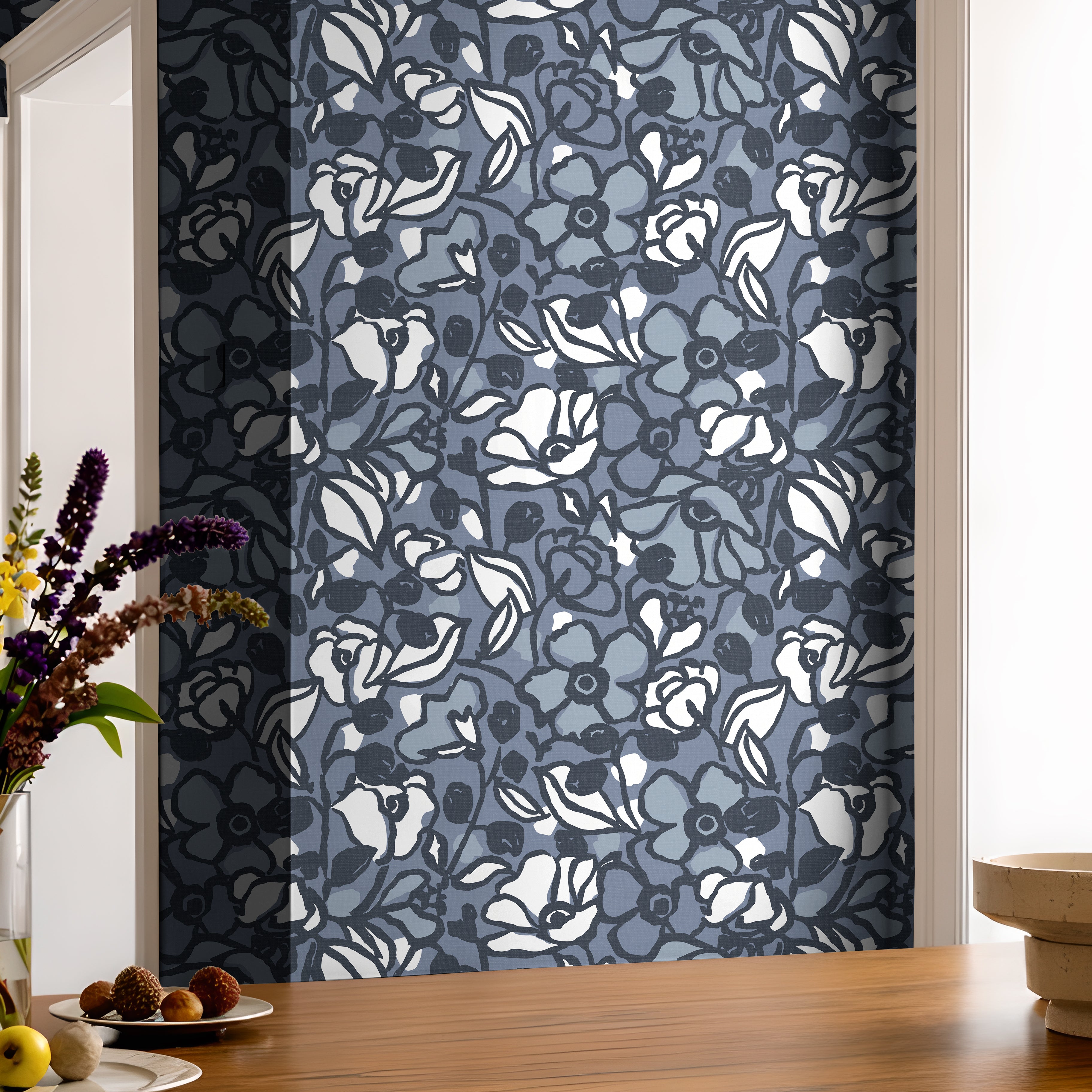 Blue botanical wallpaper featuring hand drawn flowers and layered floral details.