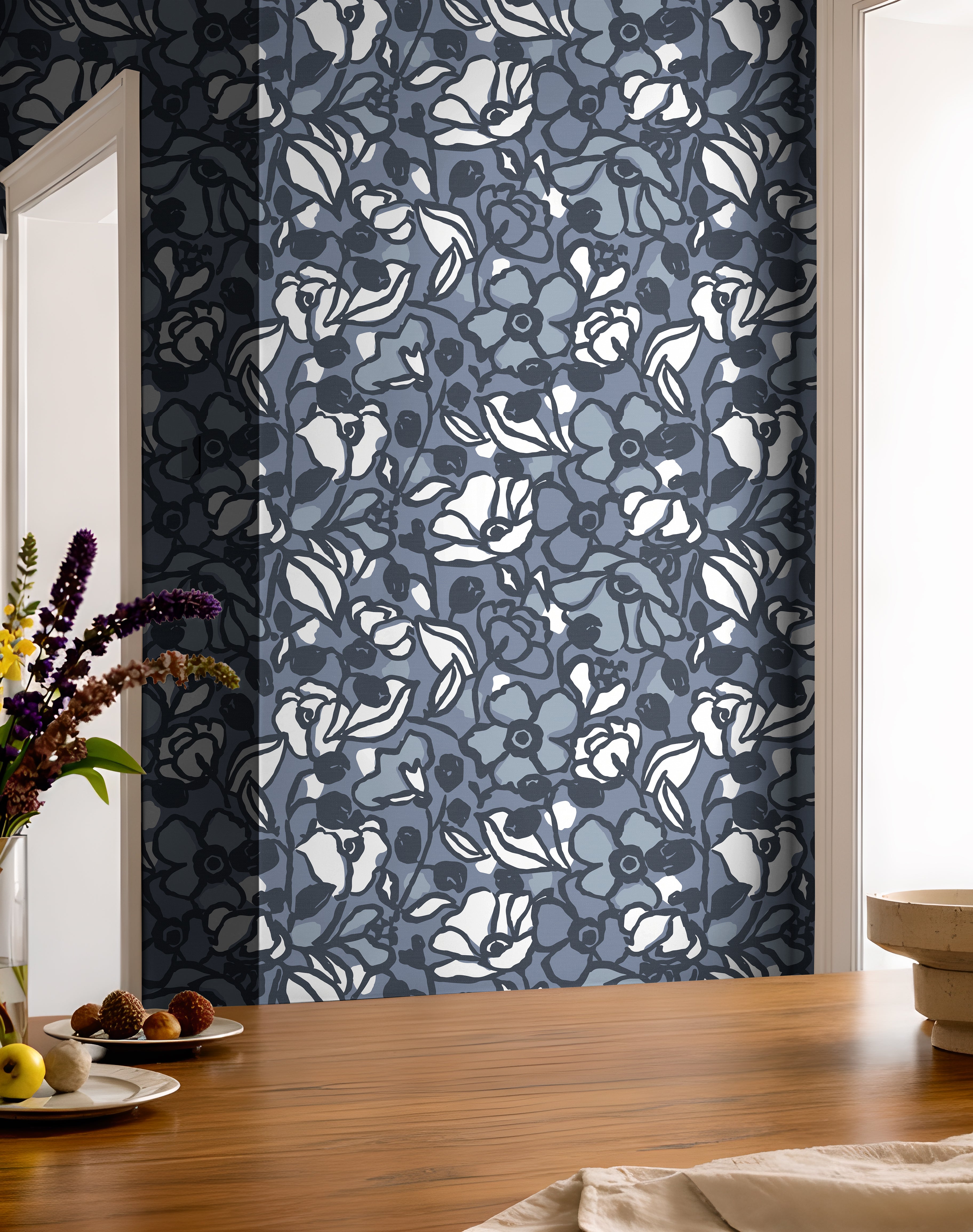 Blue botanical wallpaper featuring hand drawn flowers and layered floral details.