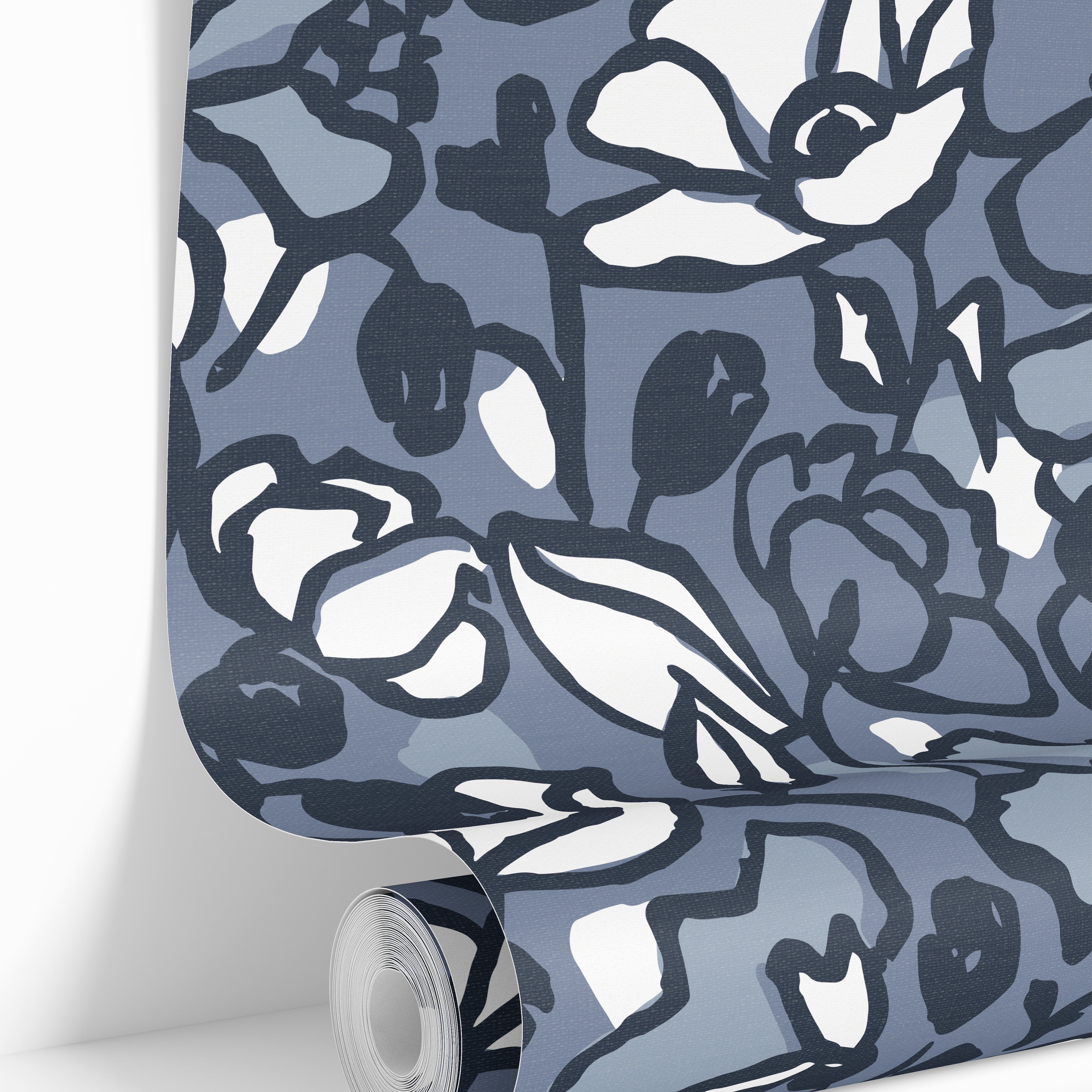 Romantic blue floral wallpaper paired with natural textures and fresh flowers.