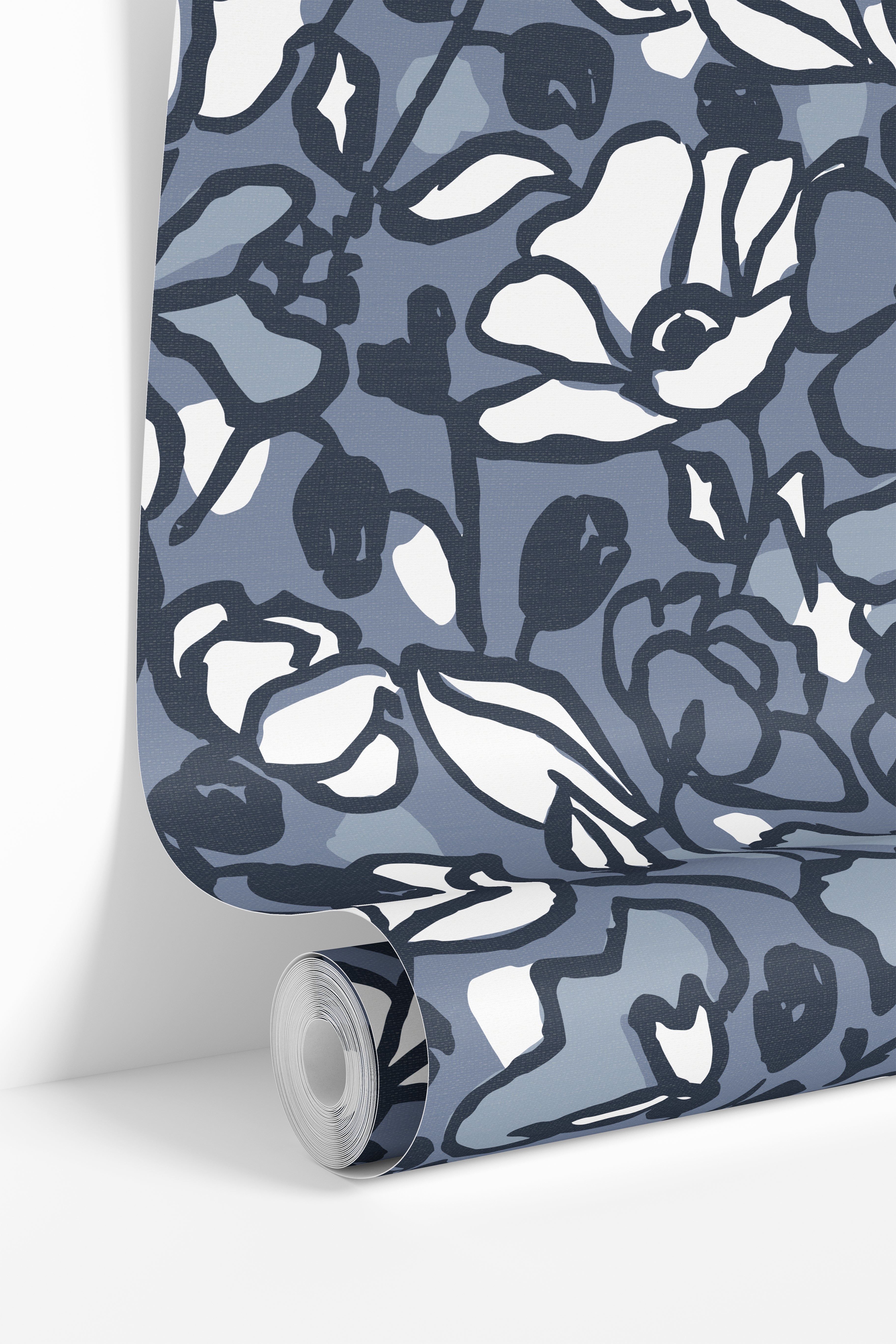 Romantic blue floral wallpaper paired with natural textures and fresh flowers.