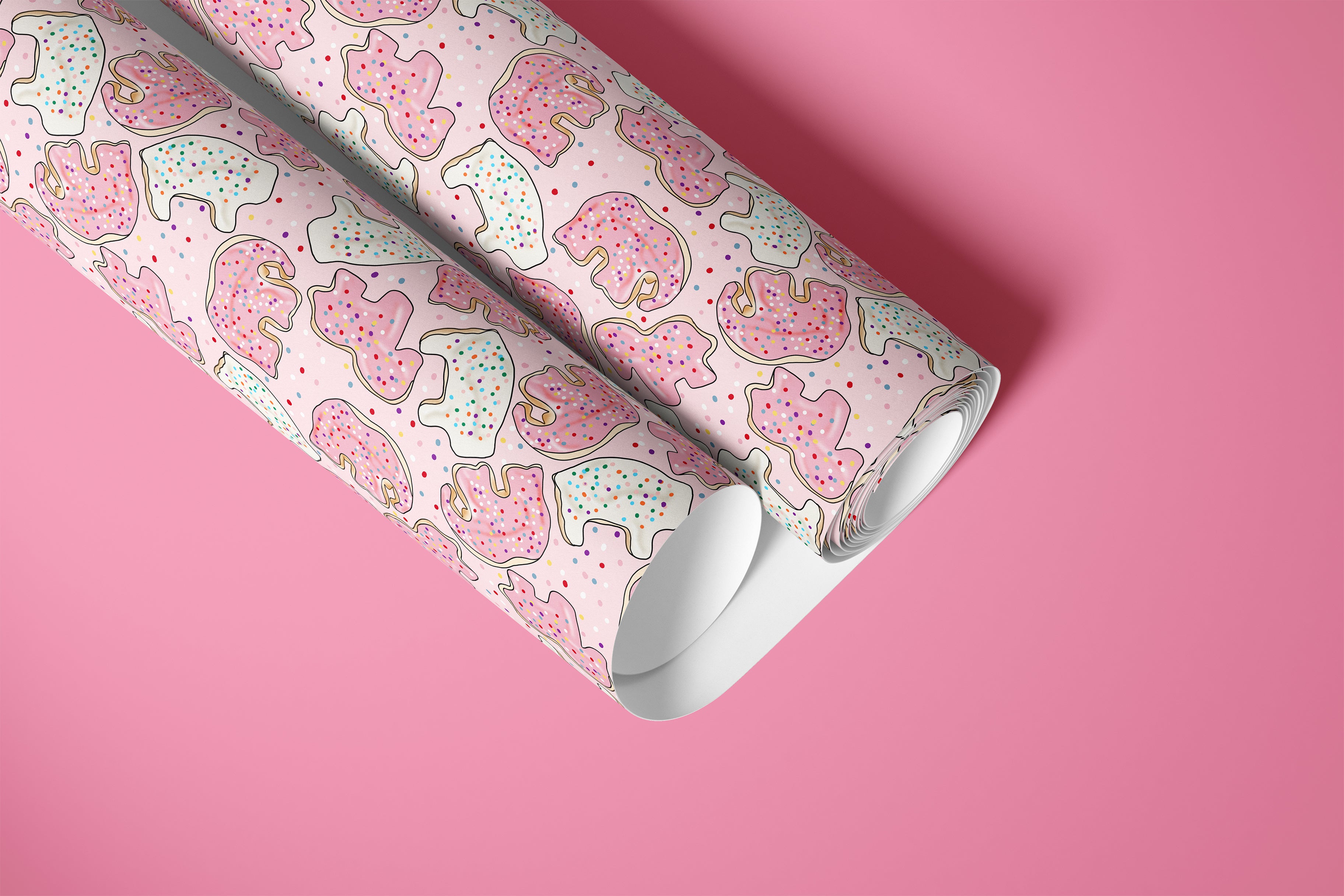 roll of sprinkle safari pink contact paper with frosted animal cookies and colorful sprinkles on hot pink background
