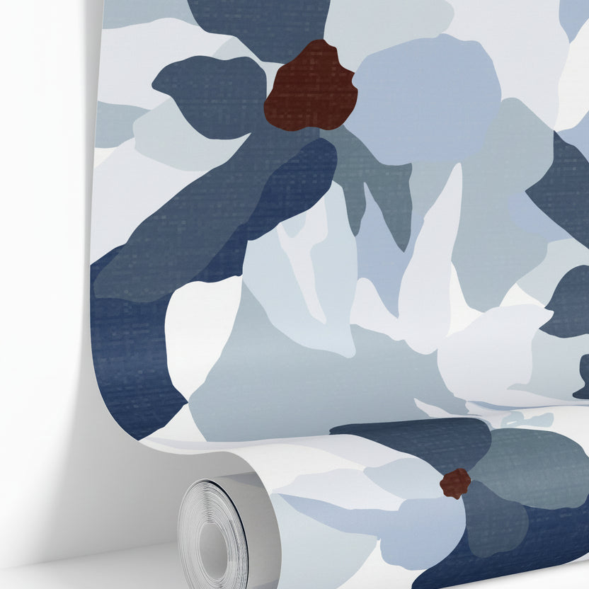 wallpaper roll showing blue gray floral pattern detail

