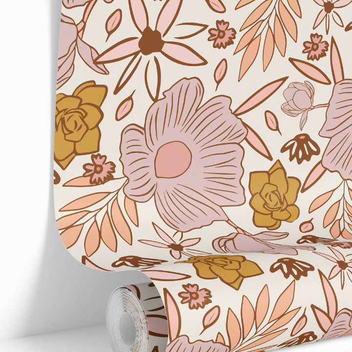 Sweetbriar Nursery wallpaper roll showing blush, peach, and mustard floral pattern on an ivory base