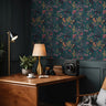  Desk workspace featuring Tealmore Wilds teal botanical wallpaper with butterflies, wildflowers, and golden florals.