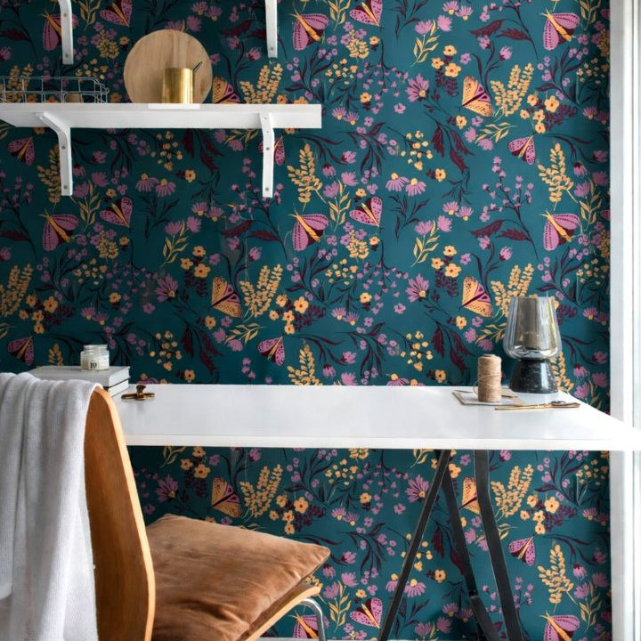  Interior room styled with Tealmore Wilds wallpaper showing butterflies and wildflowers on a rich teal botanical background.