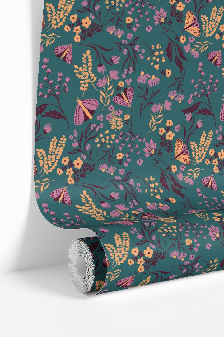Wallpaper roll displaying Tealmore Wilds teal botanical wallpaper pattern with butterflies and wildflowers.
