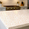 terracina terrazzo countertop film installed on modern kitchen island in warm neutral tones
