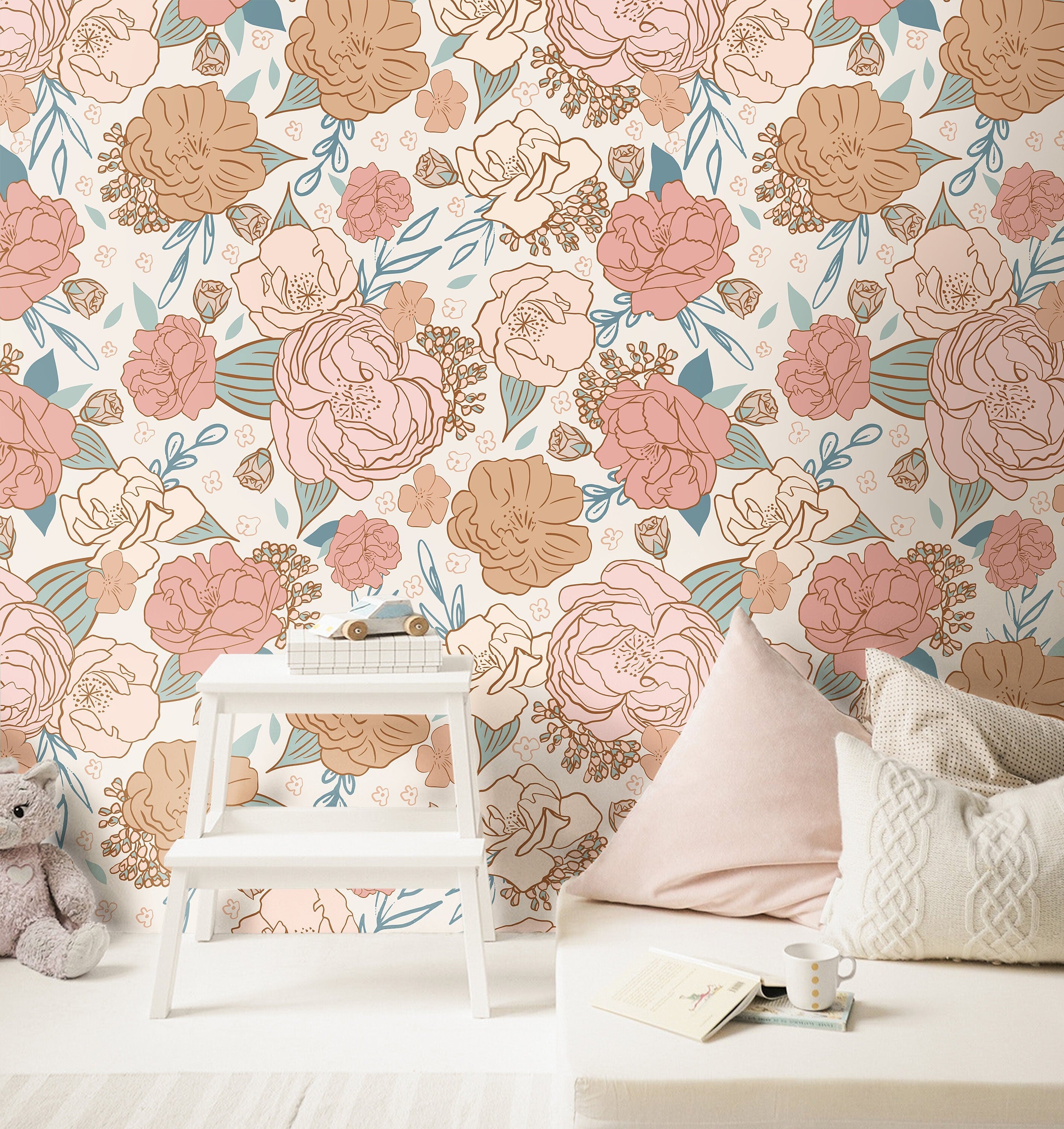 blush and peach floral wallpaper in reading nook with white bench books cushions and woven storage
