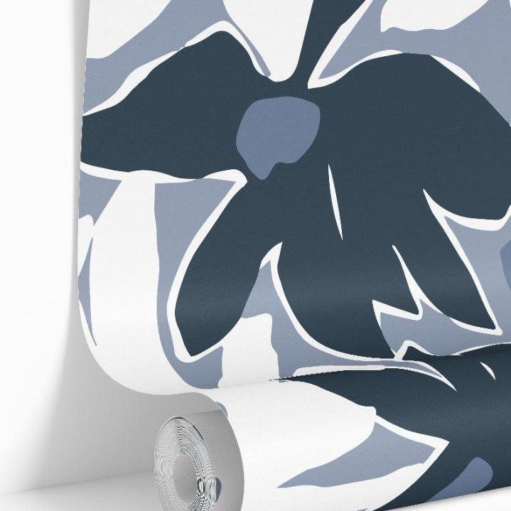 Rolled wallpaper showcasing the soft coastal blue print.