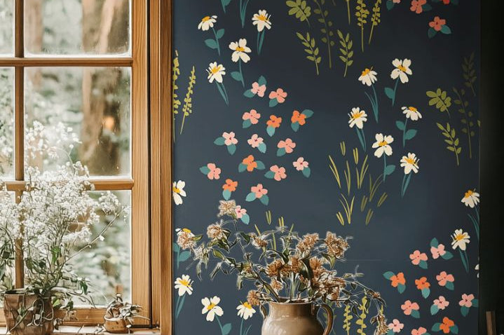 Dining area with Vivenne Grove Wallpaper showcasing coral, gold, and sage florals on navy walls for an elegant and vibrant look.