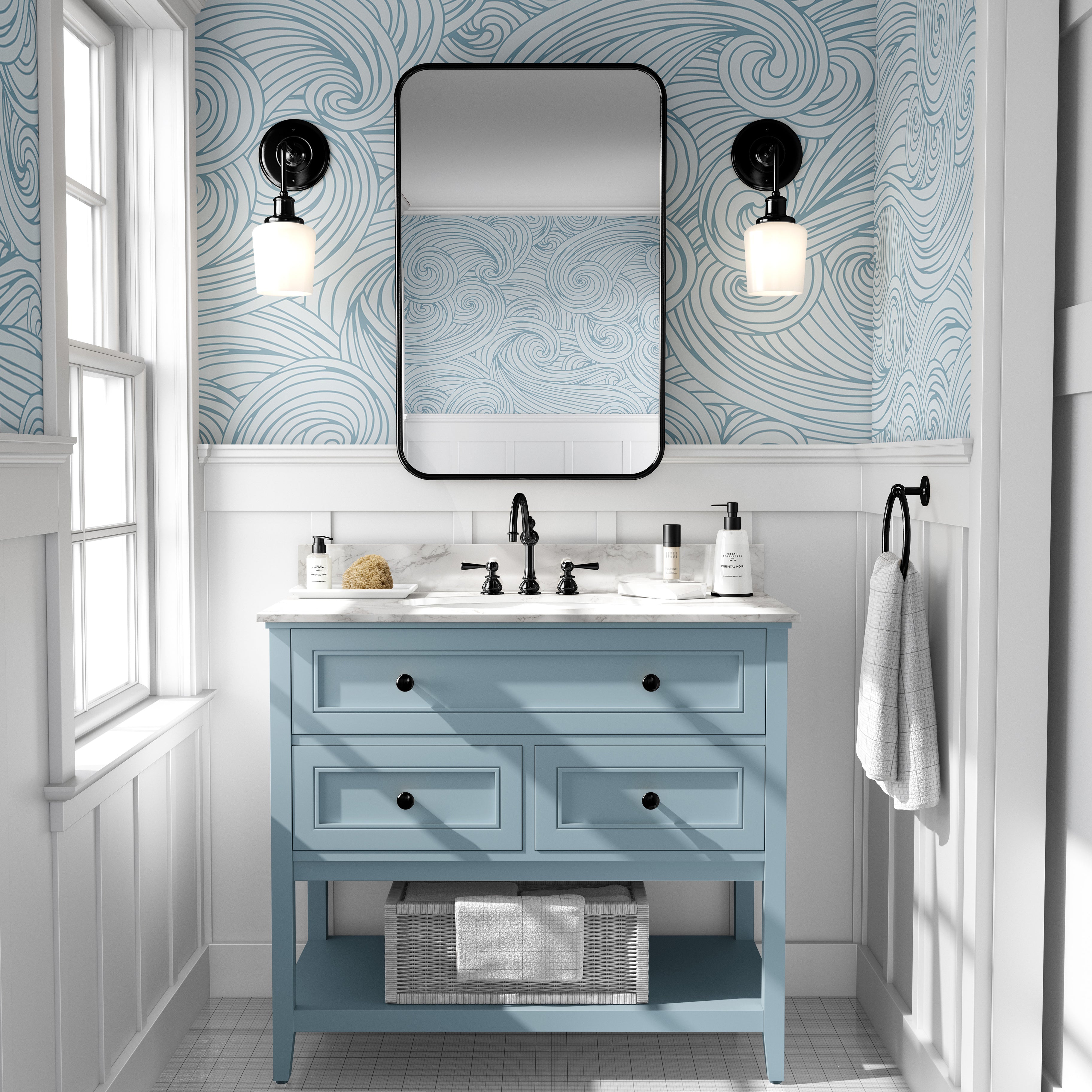 Blue coastal wallpaper with flowing wave patterns styled in a bright modern bathroom with soft coastal decor.