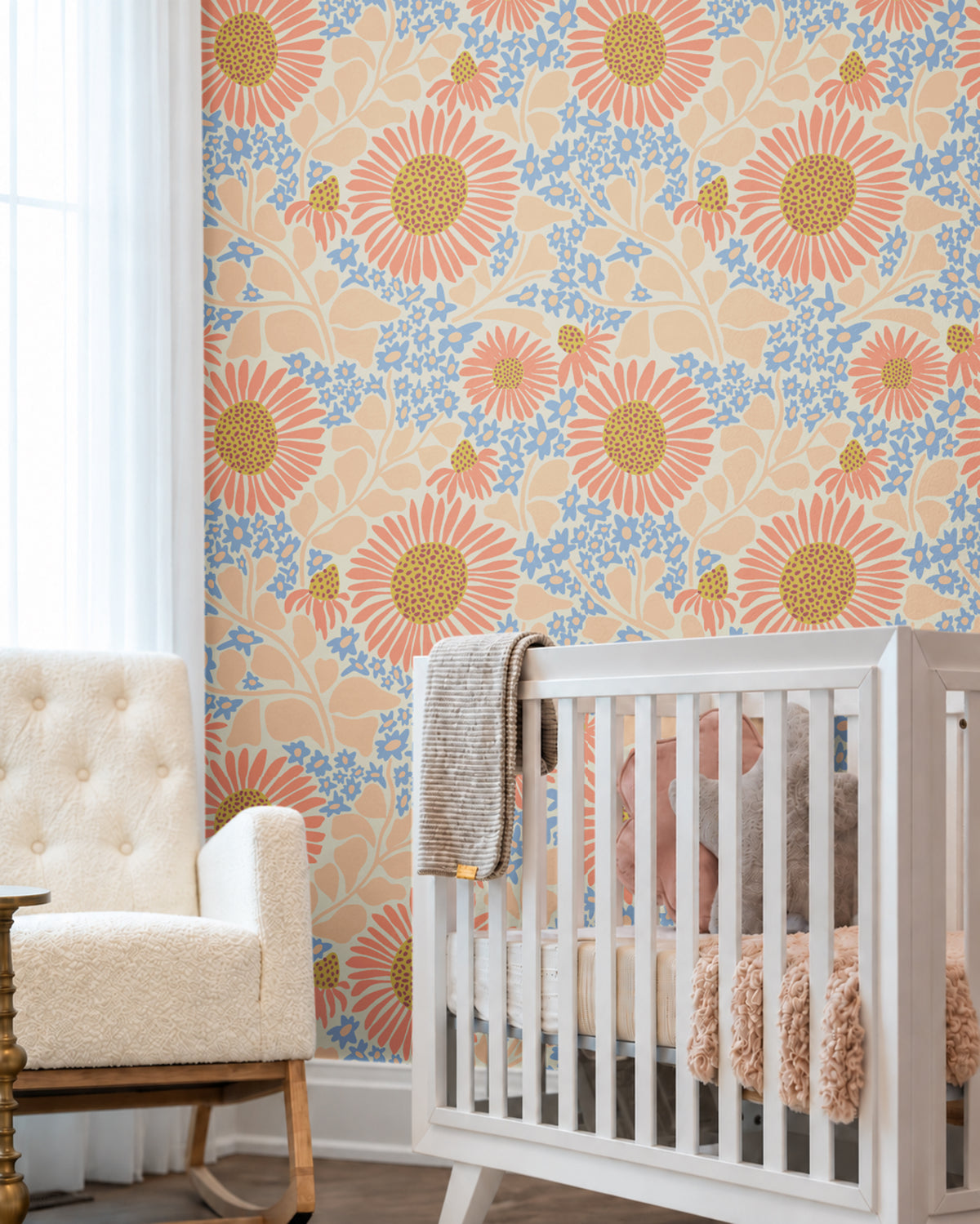 Warm Bloom colorful floral wallpaper with coral flowers, soft blue blossoms and peach foliage in a bright neutral nursery