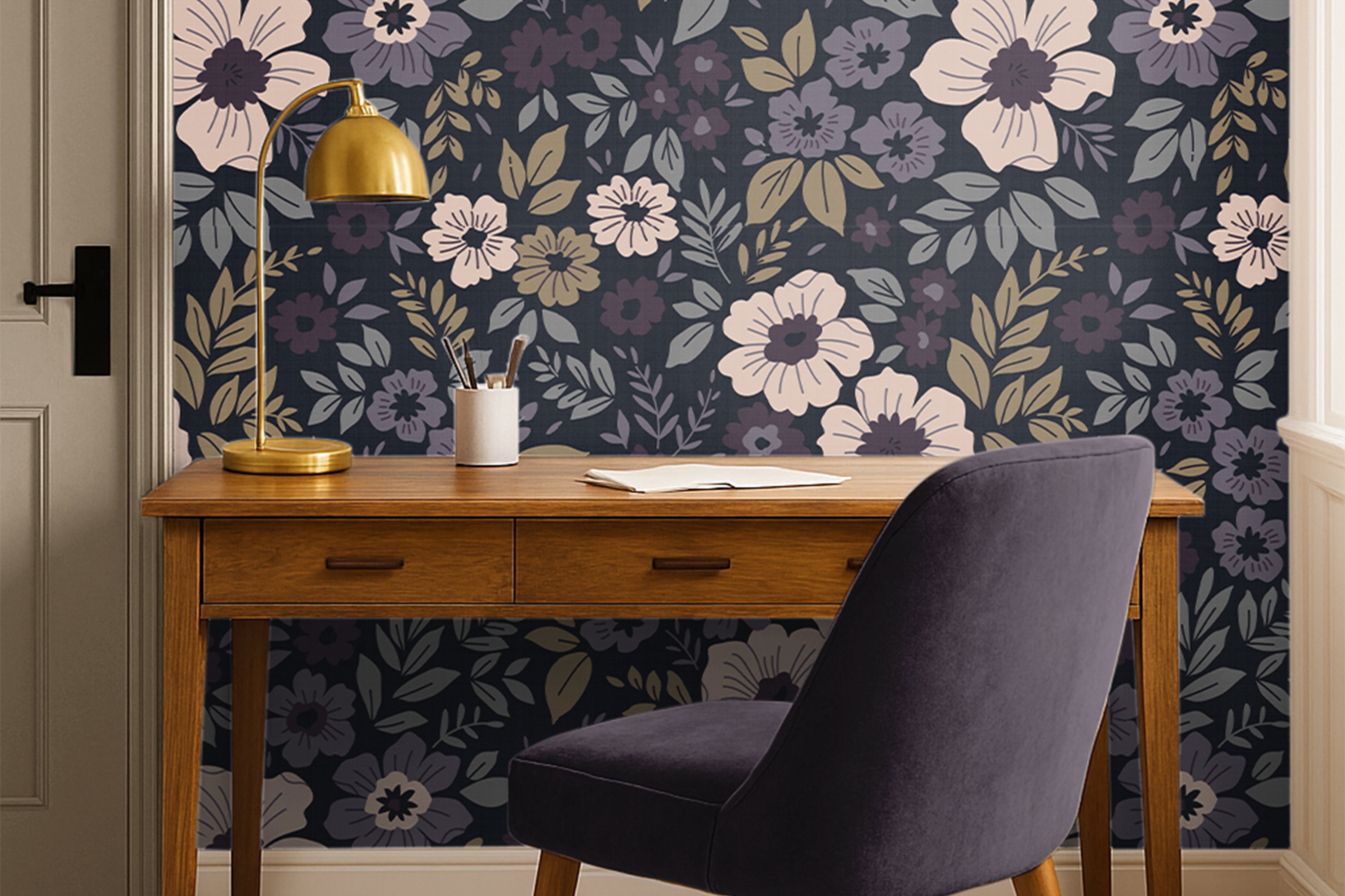 plum floral wallpaper behind plum chair and warm wood office desk 
