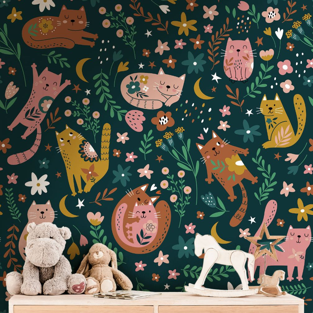 dark teal cat and flower wallpaper in reading nook with low bookshelf floor cushion lamp and childrens
books
