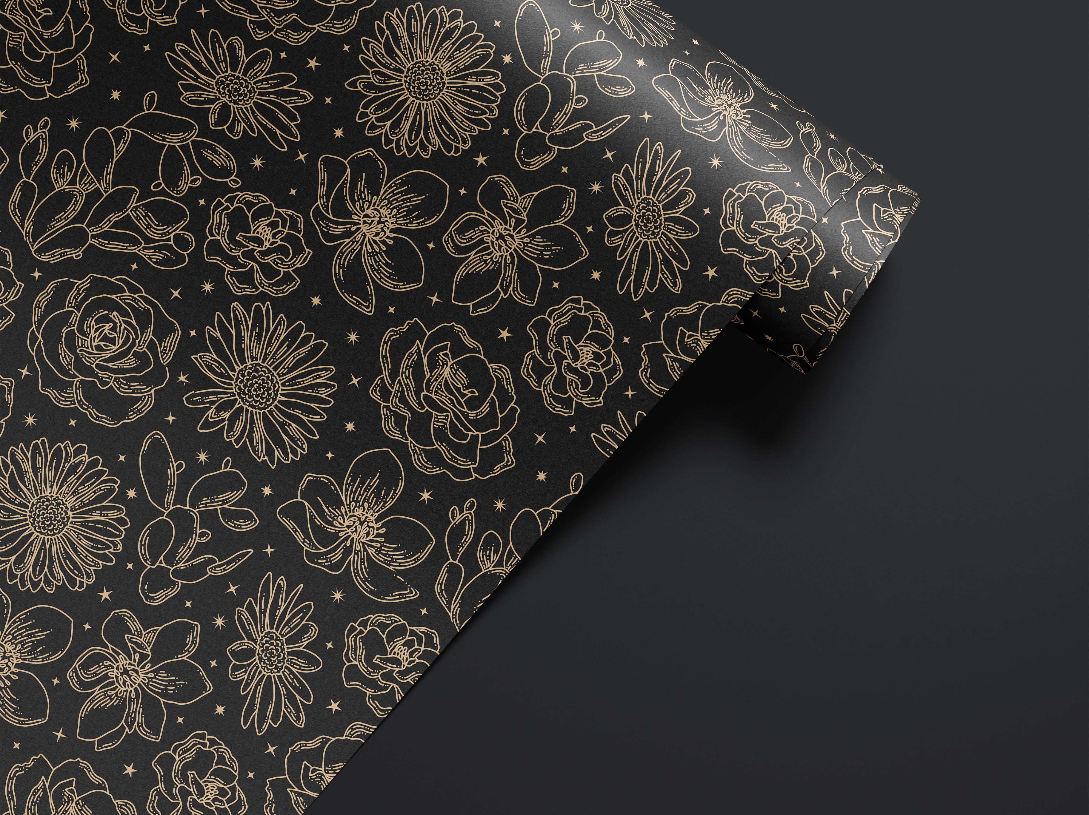 Roll of Wild Noir dark floral contact paper with black and gold botanical sketch pattern.