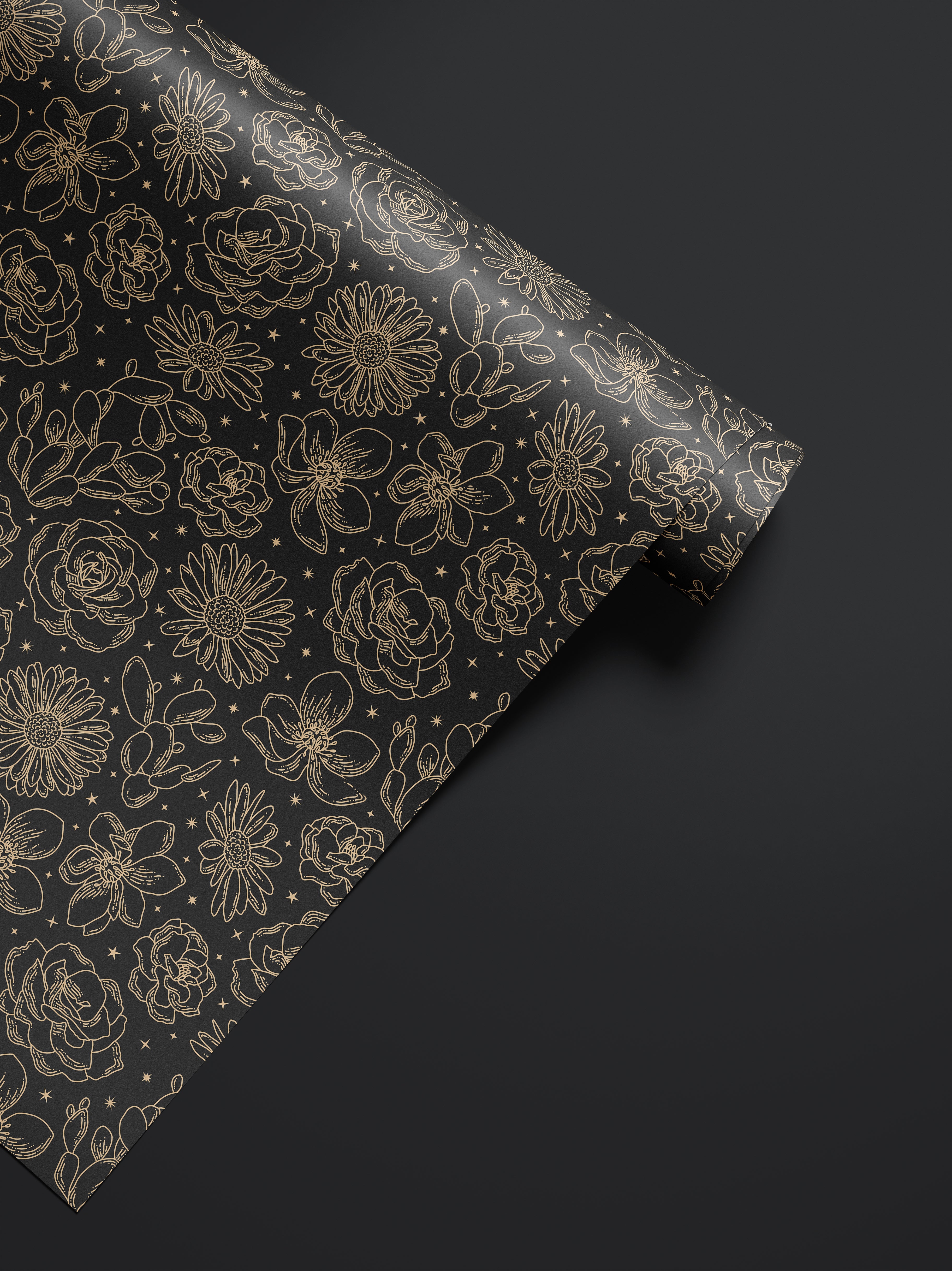 Roll of Wild Noir dark floral contact paper with black and gold botanical sketch pattern.