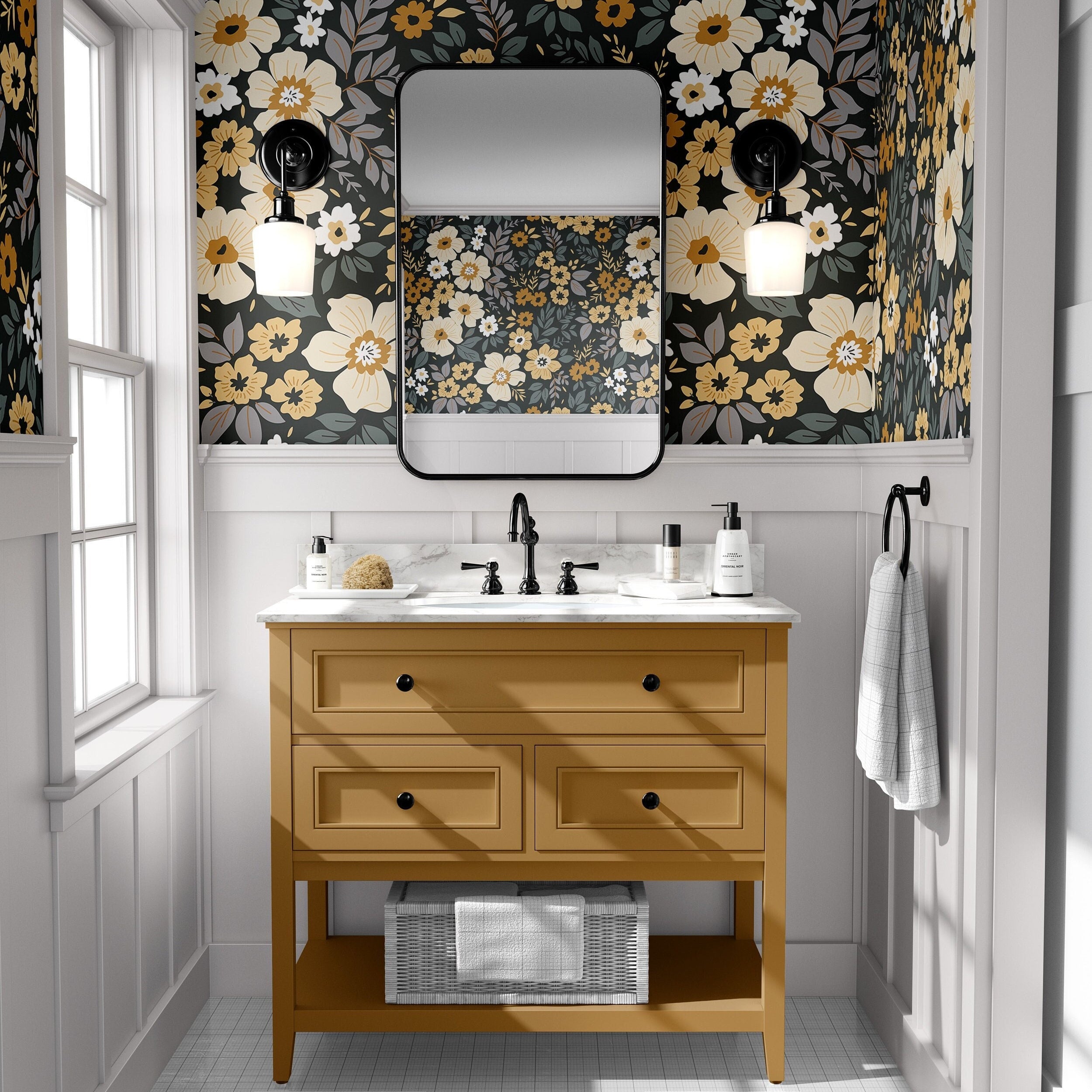 charcoal floral wallpaper in powder room with mustard vanity black framed mirror black sconces and white paneling
