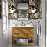 charcoal floral wallpaper in powder room with mustard vanity black framed mirror black sconces and white paneling