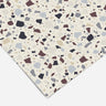 Contact paper 117 A close-up of neutral terrazzo contact paper with a white background and speckled pattern in shades of gray, taupe, and black, ideal for modern interiors, countertops, and DIY home projects.